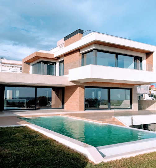 white and brown concrete building under blue sky during daytime